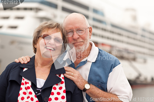 Image of Senior Couple On Shore in Front of Cruise Ship