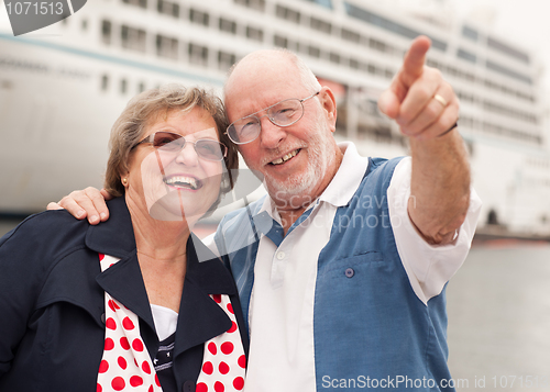 Image of Senior Couple On Shore in Front of Cruise Ship