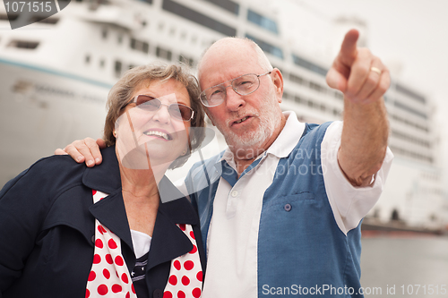 Image of Senior Couple On Shore in Front of Cruise Ship