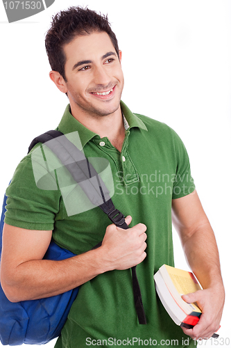 Image of Smiling Young student carrying bag and books