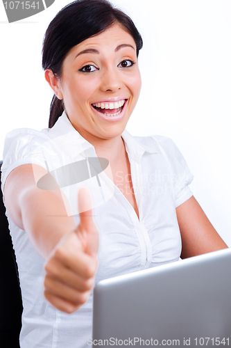 Image of Excited business woman showing thumbs up