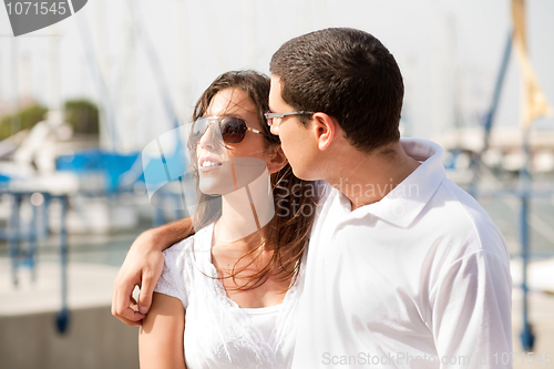 Image of Portrait of young happy couple at the harbour