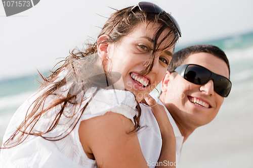 Image of playful young couple look back and smiling