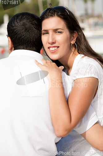 Image of Portrait of pretty woman holding her husband