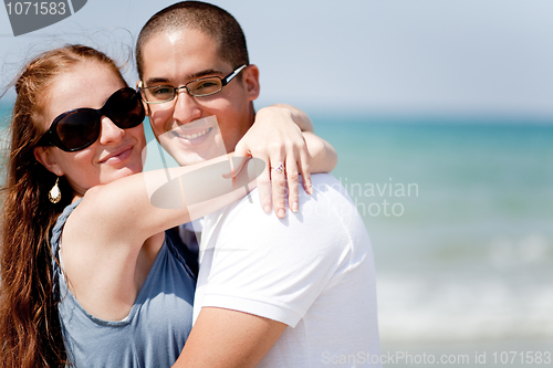 Image of Loving couple together at the beach