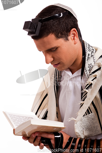 Image of Close up of a young  jewish man with book