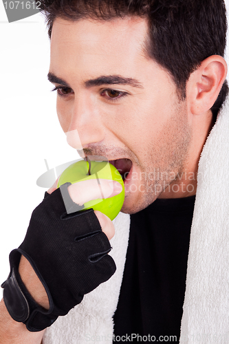 Image of Fitness man having green apple