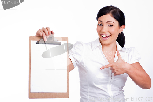 Image of Lovely woman  Pointing blank Clip board