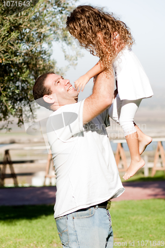 Image of Father playing with Daughter