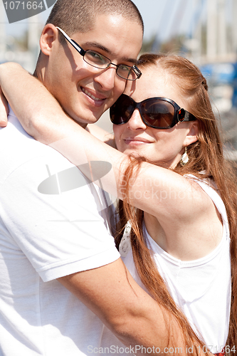 Image of Close up portrait of a happy couple hugging