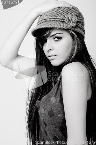 Image of Closeup shot of a beautiful fashion model with a designer cap