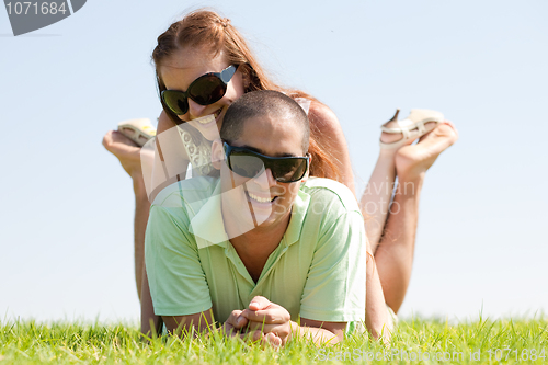 Image of Happy couple enjoying in a park