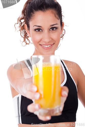 Image of fitness girl showing a fresh juice,focus on girl