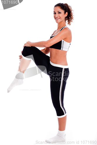 Image of young woman making  exercise on the studio