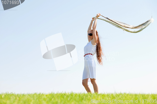 Image of Young american woman with flying veil