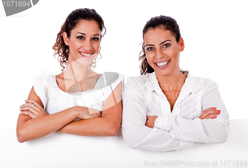 Image of Close up portrait of young business women's with their hands folded