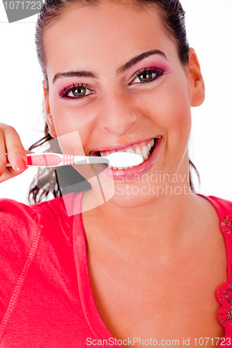 Image of cute girl brusing her teeh