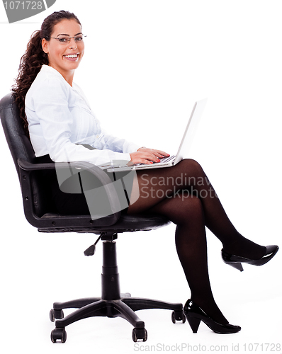 Image of Smiling business woman with laptop
