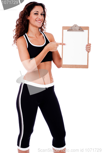 Image of Fitness woman showing a blank clip board