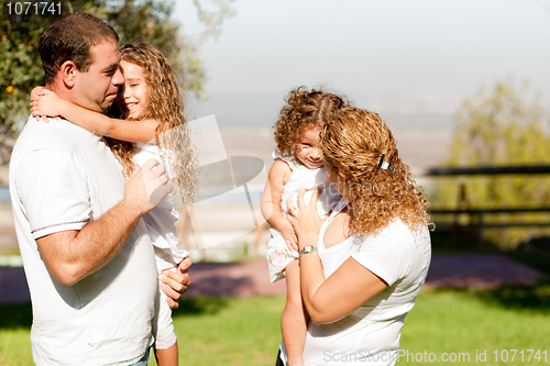 Image of Side View of a family in the park