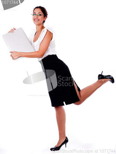 Image of Business Woman raise his left leg with laptop