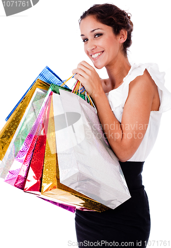 Image of portrait of pretty young women smiling with shopping bag