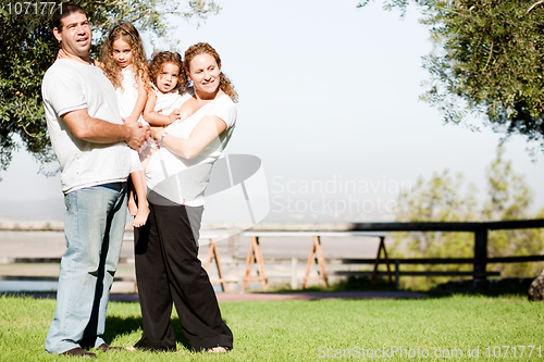 Image of Young family posing for a picture