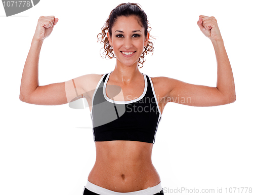 Image of Woman raising her hands doing exercises