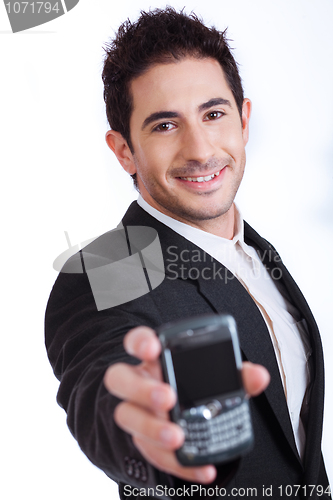 Image of Young business man showing mobile phone