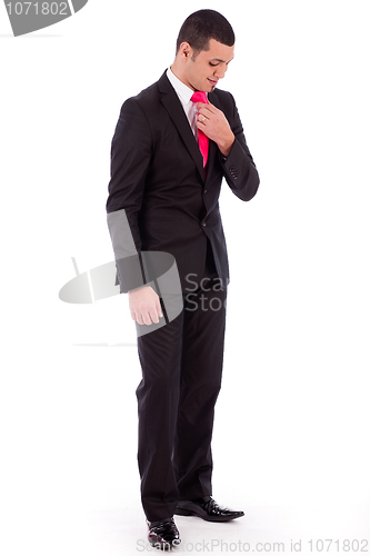 Image of Business man bending his head down to fit his necktie