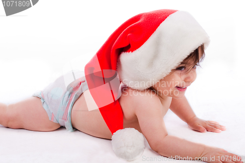 Image of Santa baby trying to crawl