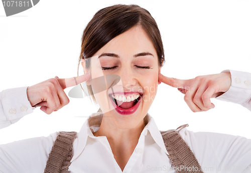 Image of smiling young attractive model closing her eyes and ears