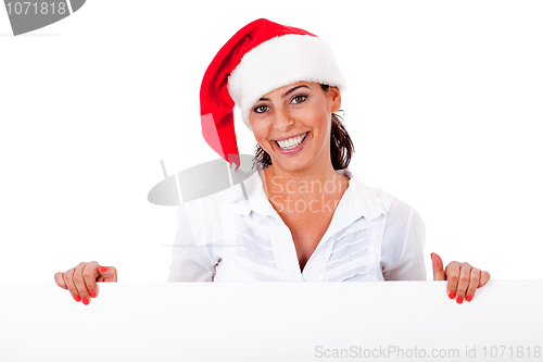 Image of Santa girl smiling behind the white board