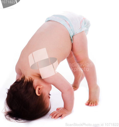 Image of Baby bending down frontwards