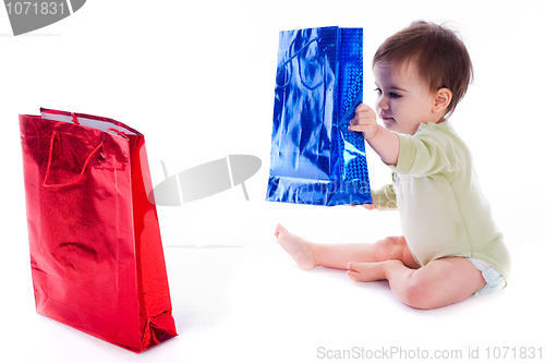 Image of Baby holding the shopping bag