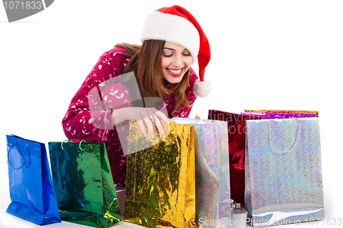 Image of Santa girl looking into the shopping bags