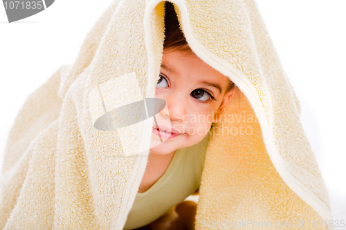 Image of Baby looking out from under his blanket