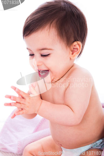 Image of Baby enjoying by clapping hands