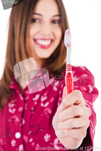 Image of Young women showing the toothbrush