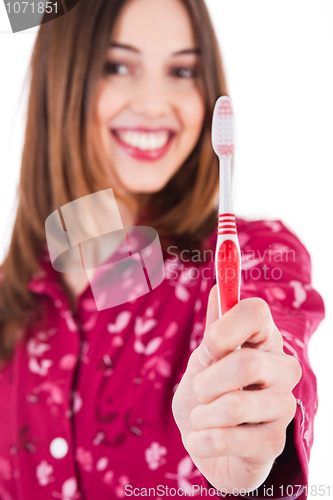 Image of Young women showing the toothbrush