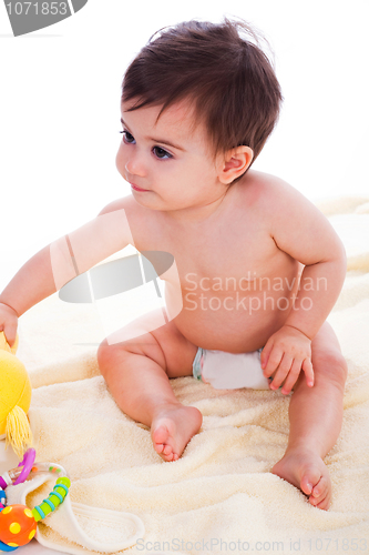 Image of Toddler sitting with toys