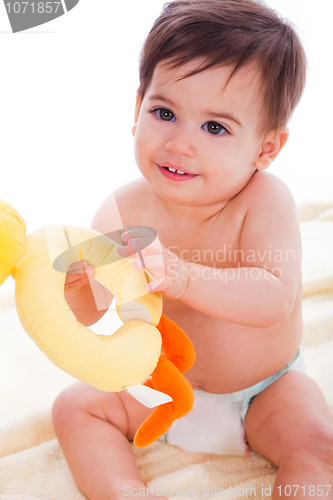 Image of Baby play with doll