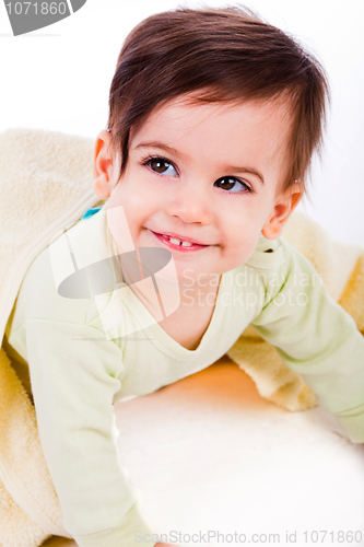 Image of Cute baby smile under yellow blanket