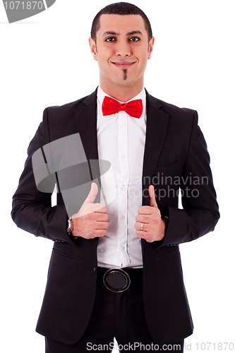 Image of Young business model posing by adjusting his coat