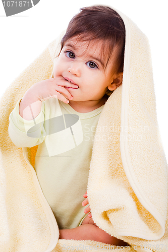 Image of Innocent baby wrapped with a yellow towel
