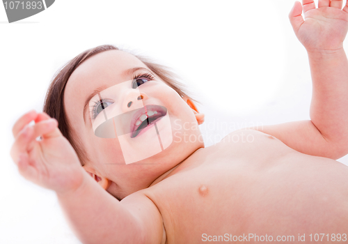 Image of Closeup of  happy baby with hands up