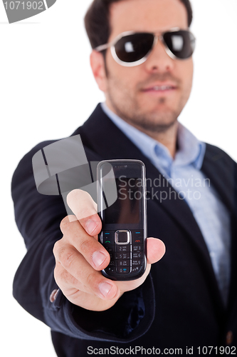 Image of Business man wearing sunglasses and showing a Nokia mobile