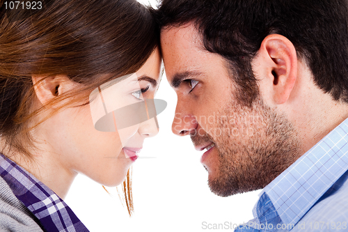 Image of Beautiful couple smiling and facing each other