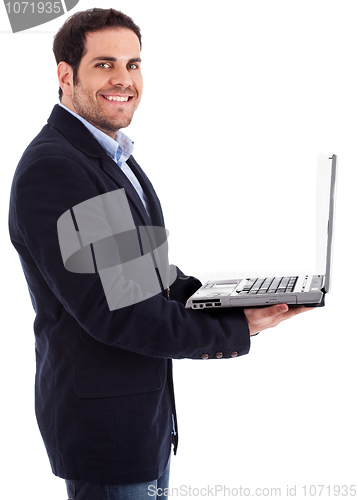 Image of Young professional smiling with a laptop in his hand