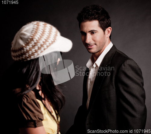 Image of Attractive young man looking at trendy woman